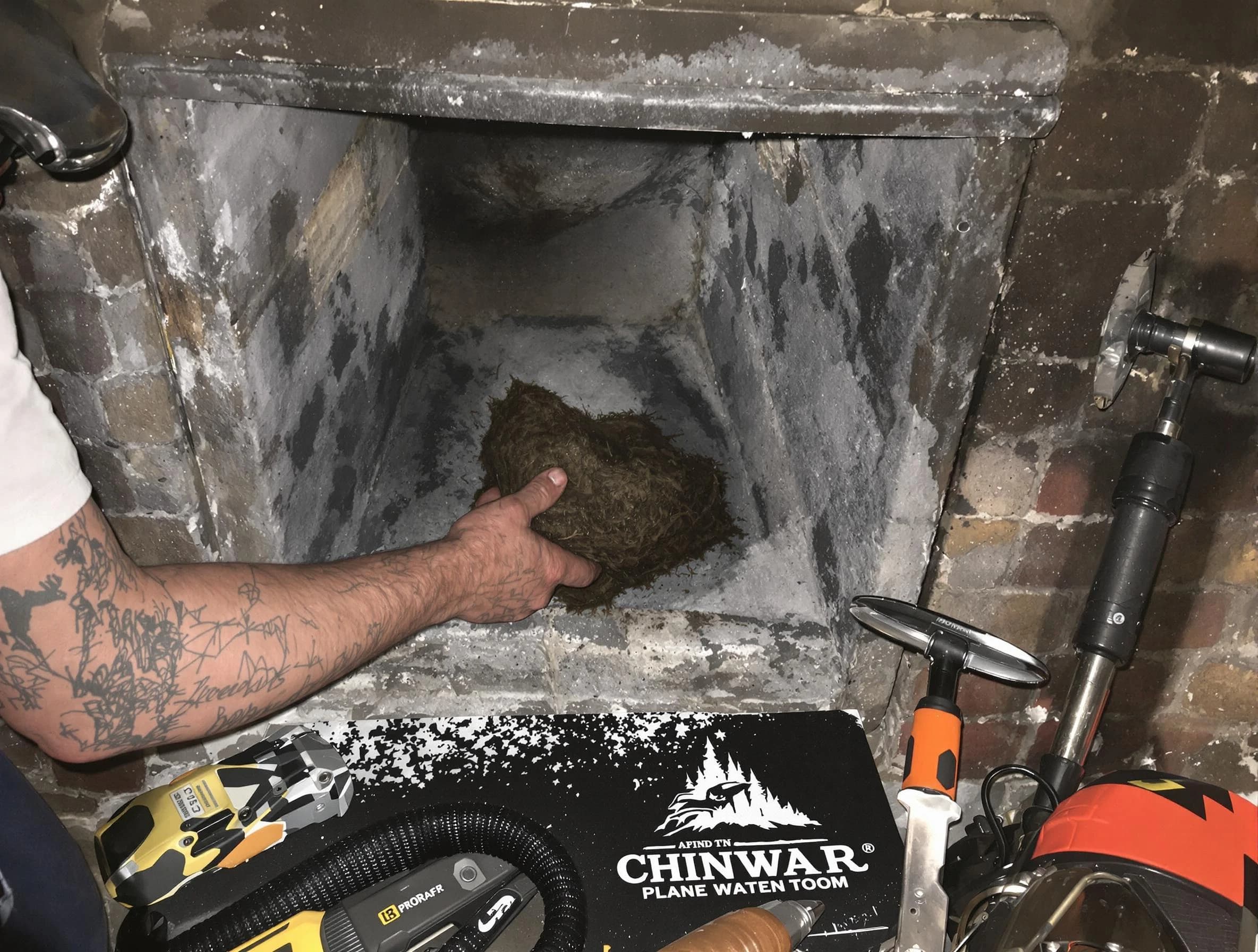 West Orange Chimney Sweep safely removing debris and screening chimney in West Orange, NJ