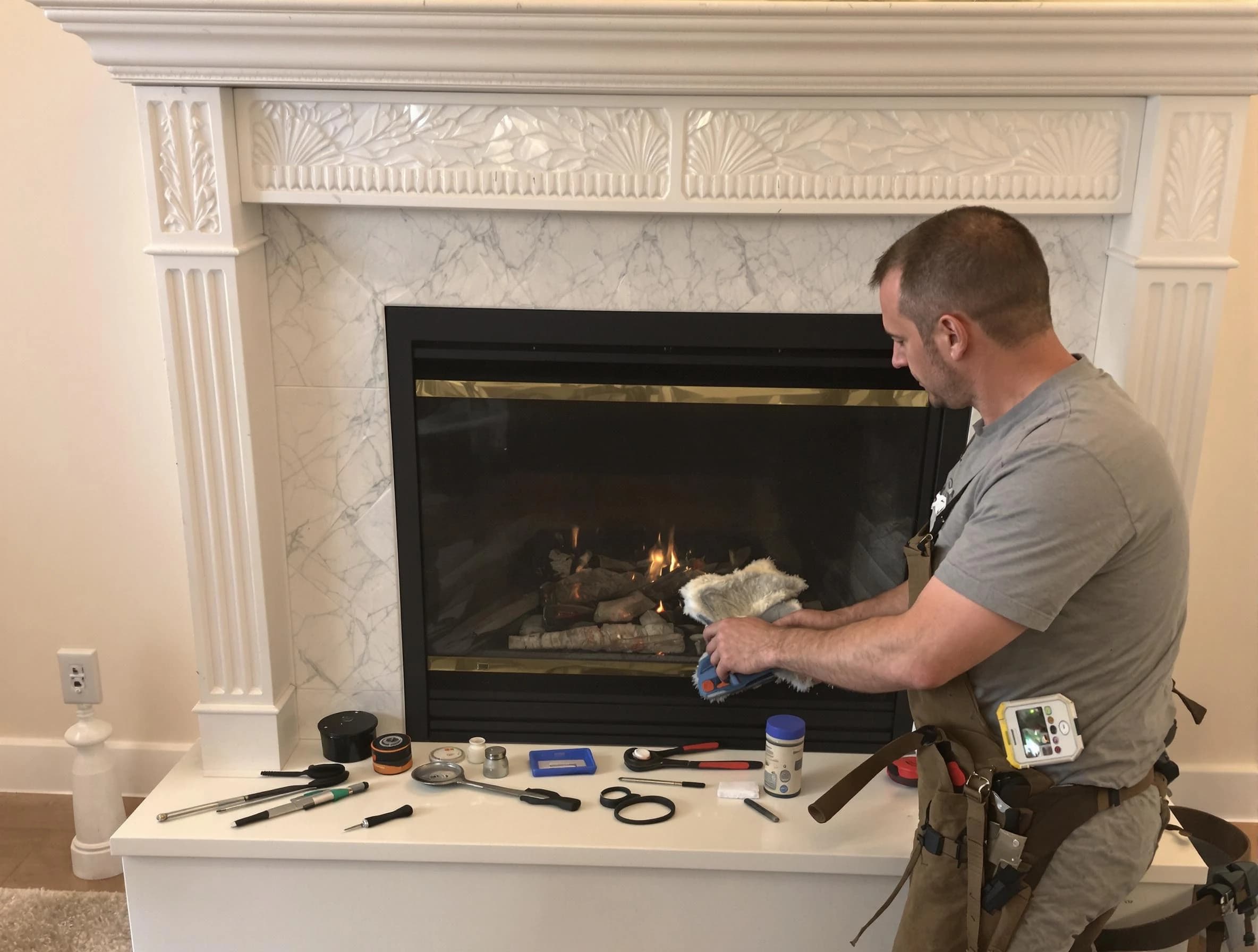 West Orange Chimney Sweep performing fireplace maintenance in West Orange, NJ